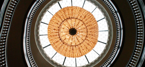 Looking up at a light and skylight in the rotunda.